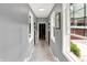 Light filled hallway with large windows, light gray walls, and light colored floors at 4123 S Village Row, New Palestine, IN 46163