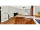 Traditional kitchen island featuring wood cabinets and granite countertops at 4123 S Village Row, New Palestine, IN 46163