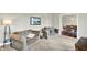 Comfortable living room featuring plush armchairs, carpeted floors, and neutral paint at 4123 S Village Row, New Palestine, IN 46163