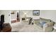 Inviting living room with plush armchairs, soft carpet, and natural light at 4123 S Village Row, New Palestine, IN 46163