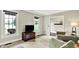 Comfortable living room features large windows and plush seating at 4123 S Village Row, New Palestine, IN 46163