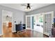 Living room featuring hardwood floors, French doors, and lots of natural light at 4123 S Village Row, New Palestine, IN 46163