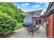 Backyard patio with an umbrella, an outdoor dining set, and a grill at 4123 S Village Row, New Palestine, IN 46163