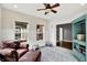 Bright sunroom featuring a leather chair, lots of natural light, and backyard views at 4123 S Village Row, New Palestine, IN 46163