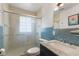 Bathroom with a glass shower, tile accents, and a sleek marble-top vanity at 4125 Bowman Ave, Indianapolis, IN 46227