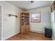 Bedroom with hardwood floors, a window, and a storage cabinet at 4125 Bowman Ave, Indianapolis, IN 46227