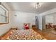 Bedroom with hardwood floors, natural light, and large closet with sliding mirror doors at 4125 Bowman Ave, Indianapolis, IN 46227