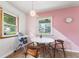 Dining area with pink accent wall, and natural lighting at 4125 Bowman Ave, Indianapolis, IN 46227