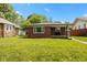 Charming brick home with well-maintained lawn and inviting curb appeal at 4125 Bowman Ave, Indianapolis, IN 46227