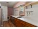 Kitchen boasts wood cabinets, white countertop, stainless steel dishwasher and sink, and updated fixtures at 4125 Bowman Ave, Indianapolis, IN 46227