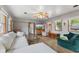 Open-concept living room features hard wood floors, comfortable seating, and a bright sunny atmosphere at 4125 Bowman Ave, Indianapolis, IN 46227