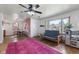 Bright living room featuring hardwood floors, large windows, and a vibrant pink rug at 4125 Bowman Ave, Indianapolis, IN 46227