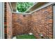 Brick enclosed backyard with outdoor light at 423 Bent Tree Ln, Indianapolis, IN 46260