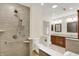 Bright bathroom featuring a tiled shower and vanity with double sinks at 423 Bent Tree Ln, Indianapolis, IN 46260