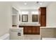 Spacious bathroom featuring a double vanity with framed mirrors and tiled floors at 423 Bent Tree Ln, Indianapolis, IN 46260