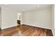 Large bedroom with hardwood floors and an open doorway leading to a bathroom at 423 Bent Tree Ln, Indianapolis, IN 46260