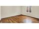 Spacious bedroom with hardwood floors and a window providing natural light at 423 Bent Tree Ln, Indianapolis, IN 46260