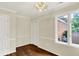 Charming dining room with hardwood floors, chandelier lighting, and bright windows at 423 Bent Tree Ln, Indianapolis, IN 46260