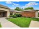 Brick home with manicured green lawn and neatly trimmed shrubs enhancing curb appeal at 423 Bent Tree Ln, Indianapolis, IN 46260