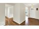 The front entrance hall featuring hardwood floors, a white front door, and a chandelier at 423 Bent Tree Ln, Indianapolis, IN 46260