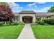Inviting brick home with well-manicured landscaping, covered entrance, and charming curb appeal at 423 Bent Tree Ln, Indianapolis, IN 46260