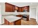 Well-lit kitchen features stainless steel appliances, wooden cabinets, and a light-colored countertop at 423 Bent Tree Ln, Indianapolis, IN 46260