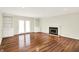 Open living room featuring hardwood floors, a fireplace, and built-in shelves at 423 Bent Tree Ln, Indianapolis, IN 46260