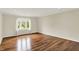 Bright living room featuring hardwood floors, recessed lighting, and a window providing natural light at 423 Bent Tree Ln, Indianapolis, IN 46260