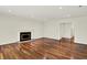 Spacious living room featuring hardwood floors and a cozy fireplace at 423 Bent Tree Ln, Indianapolis, IN 46260