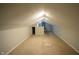 Finished attic with neutral carpet and paint, recessed lighting, and a window at 4231 Carrollton Ave, Indianapolis, IN 46205