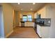 Modern kitchen with white cabinets, stainless steel appliances, granite countertops, and mosaic backsplash at 4231 Carrollton Ave, Indianapolis, IN 46205