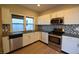 Updated kitchen featuring stainless steel appliances, granite counters, and white cabinets at 4231 Carrollton Ave, Indianapolis, IN 46205