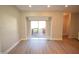 Bright living space featuring sliding glass doors to outdoor wooden deck area and neutral paint at 4231 Carrollton Ave, Indianapolis, IN 46205