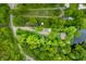 Aerial view outlining property lines of a home surrounded by verdant trees and lake access at 429 E Hoover Dr, Nineveh, IN 46164