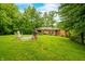 Beautiful backyard featuring a grill, outdoor seating, and lush green grass at 429 E Hoover Dr, Nineveh, IN 46164