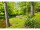 Lush backyard with a serene lake and private dock, a peaceful outdoor retreat at 429 E Hoover Dr, Nineveh, IN 46164