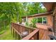 Wood deck with views of lush landscaping and the private creek at 429 E Hoover Dr, Nineveh, IN 46164