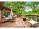 Wood deck features an outdoor table with chairs and view to private creek at 429 E Hoover Dr, Nineveh, IN 46164