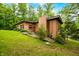 Landscaped exterior showcasing the home's brickwork, greenery, and surrounding environment at 429 E Hoover Dr, Nineveh, IN 46164
