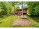 Cabin's exterior with a waterfront view, outdoor seating, and stone pathway at 429 E Hoover Dr, Nineveh, IN 46164