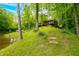 Charming cabin with waterfront access, stone steps, and a lush green lawn at 429 E Hoover Dr, Nineveh, IN 46164
