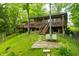 Charming lake house with a large deck, offering a peaceful retreat surrounded by nature and lush greenery at 429 E Hoover Dr, Nineveh, IN 46164