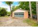 Exterior view of a detached garage, providing ample storage and parking space at 429 E Hoover Dr, Nineveh, IN 46164