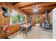 Cozy kitchen with wood walls, ceiling, dining area, and modern appliances provide a warm and inviting space at 429 E Hoover Dr, Nineveh, IN 46164