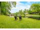 Inviting lake view with comfortable chairs and lush greenery, a perfect spot for relaxation and enjoying nature at 429 E Hoover Dr, Nineveh, IN 46164