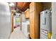 Practical laundry area equipped with washer, dryer, cabinets, and water heater at 429 E Hoover Dr, Nineveh, IN 46164