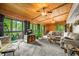 Open living room with wood ceiling, large windows and view to backyard at 429 E Hoover Dr, Nineveh, IN 46164