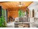 Comfortable living room with wood ceiling and sliding doors to the deck at 429 E Hoover Dr, Nineveh, IN 46164