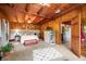 Inviting main bedroom boasts wood-paneled walls, neutral carpet, and offers a cozy retreat at 429 E Hoover Dr, Nineveh, IN 46164