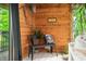 Relaxing sunroom with wooden walls, bench seating, and a calming view provides a peaceful retreat at 429 E Hoover Dr, Nineveh, IN 46164